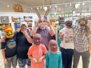 Group photo of mask makers from summer 2025, photo by Linda Allen