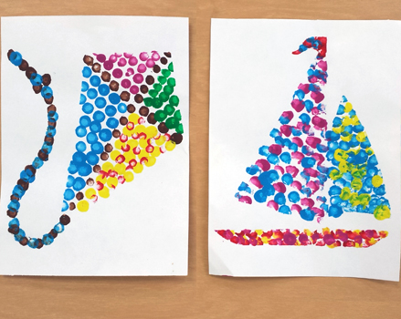 elementary pointillism project depicting a kite and a sailboat
